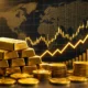 Gold bars and market charts showing gold price rising in 2026